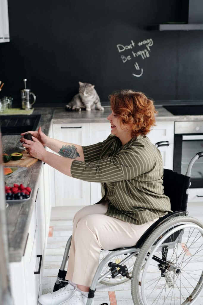 lady in wheelchair preparing food